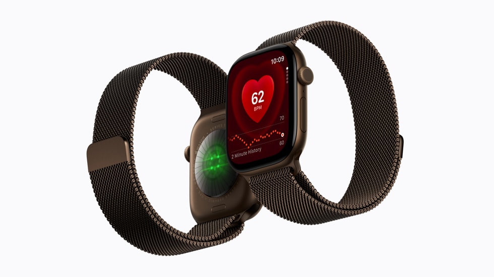 深色背景前并排放置的两只 Apple Watch Series 12,一只配编织表带,一只配运动表带,表盘上亮着健康监测界面。
